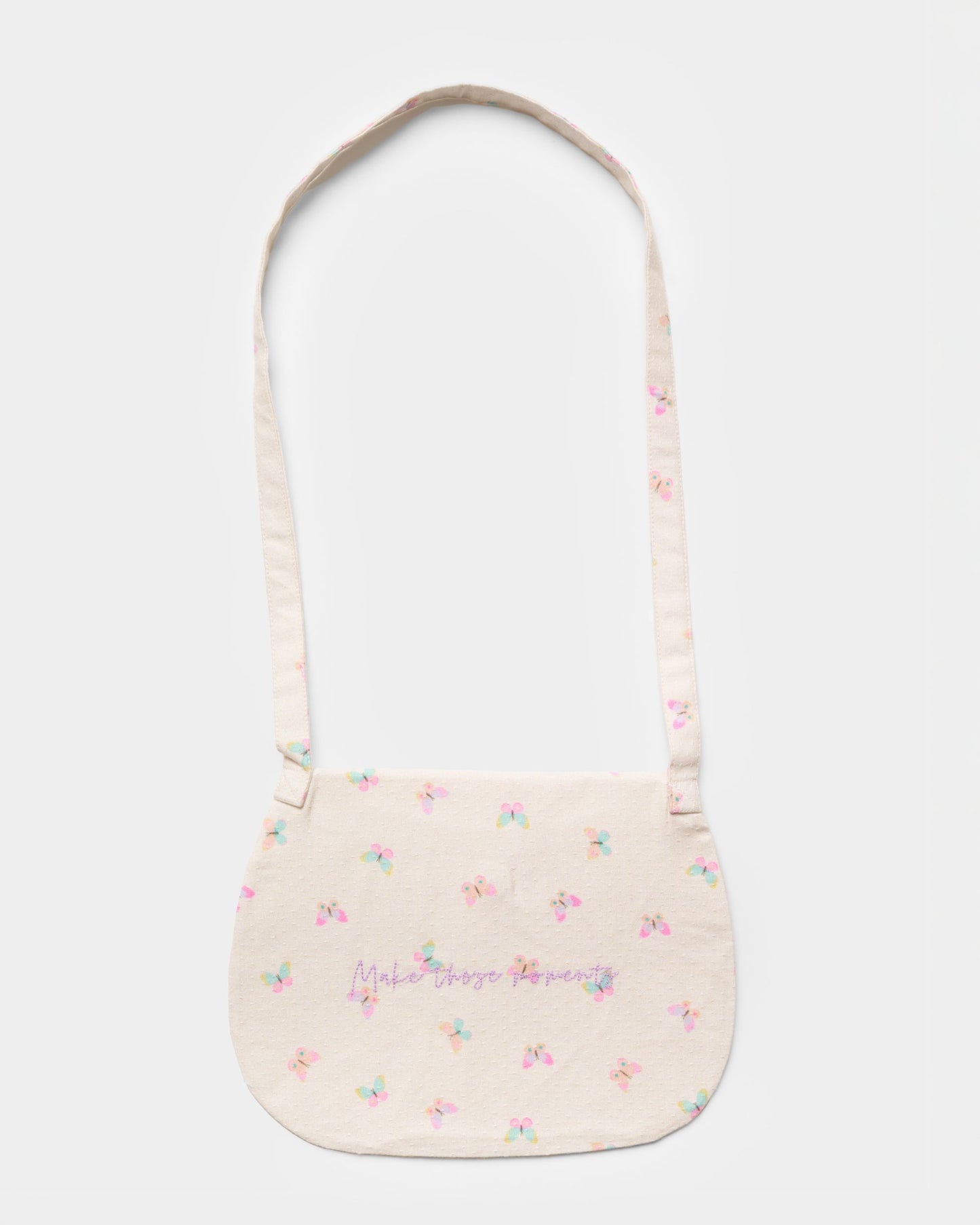 Early Sunday, Hudson Purse in Butterflies print, made from Printed Cotton Tiny Swiss Dobby fabric, featuring a gathered sling purse design with a flap closure, shown in a back flat-lay view