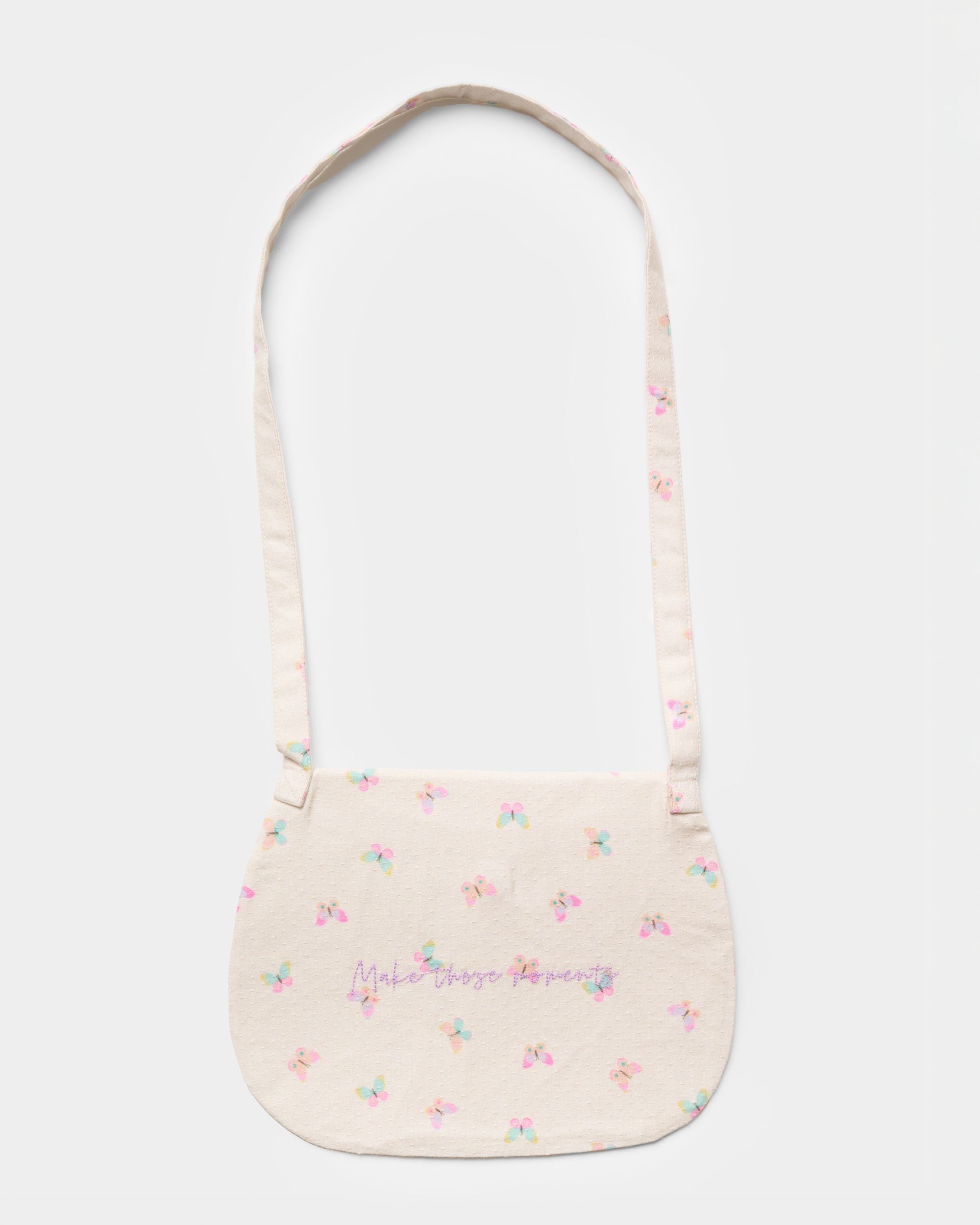 Early Sunday, Hudson Purse in Butterflies print, made from Printed Cotton Tiny Swiss Dobby fabric, featuring a gathered sling purse design with a flap closure, shown in a back flat-lay view