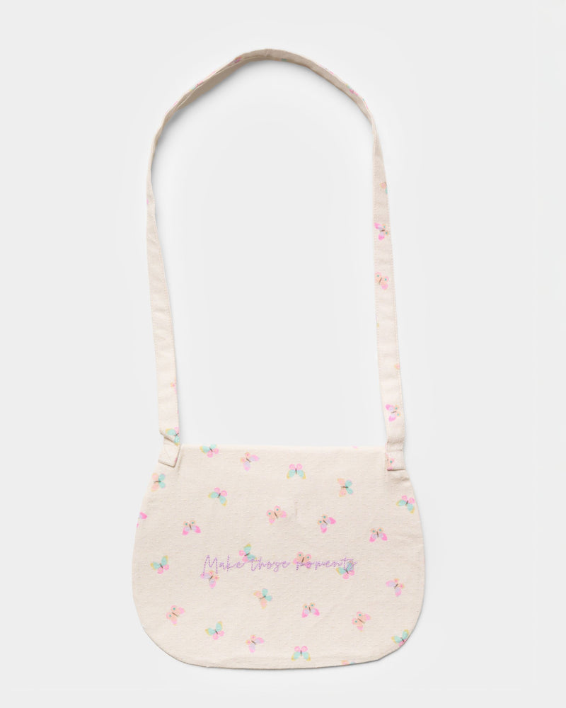 Early Sunday, Hudson Purse in Butterflies print, made from Printed Cotton Tiny Swiss Dobby fabric, featuring a gathered sling purse design with a flap closure, shown in a back flat-lay view