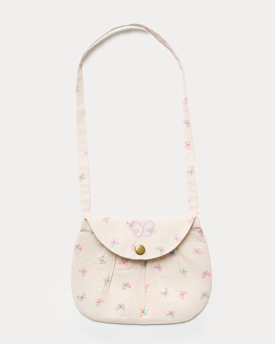 Early Sunday, Hudson Purse in Butterflies print, made from Printed Cotton Tiny Swiss Dobby fabric, featuring a gathered sling purse design with a flap closure, shown in a front flat-lay view
