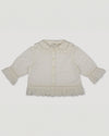 Early Sunday, Iris Blouse in Ivory color, made from All-Over Eyelet Embroidered Cotton Schifflie fabric, featuring relaxed fit with delicate detailing for a timeless and feminine look, shown in a front flat-lay view