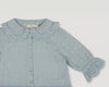 Early Sunday, Iris Blouse in Sea Dream color, made from All-Over Eyelet Embroidered Cotton Schifflie fabric, featuring relaxed fit with delicate detailing for a timeless and feminine look, shown in a closeup flat-lay view
