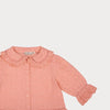 Early Sunday, Iris Blouse in Strawberry color, made from All-Over Eyelet Embroidered Cotton Schifflie fabric, featuring relaxed fit with delicate detailing for a timeless and feminine look, shown in a closeup flat-lay view
