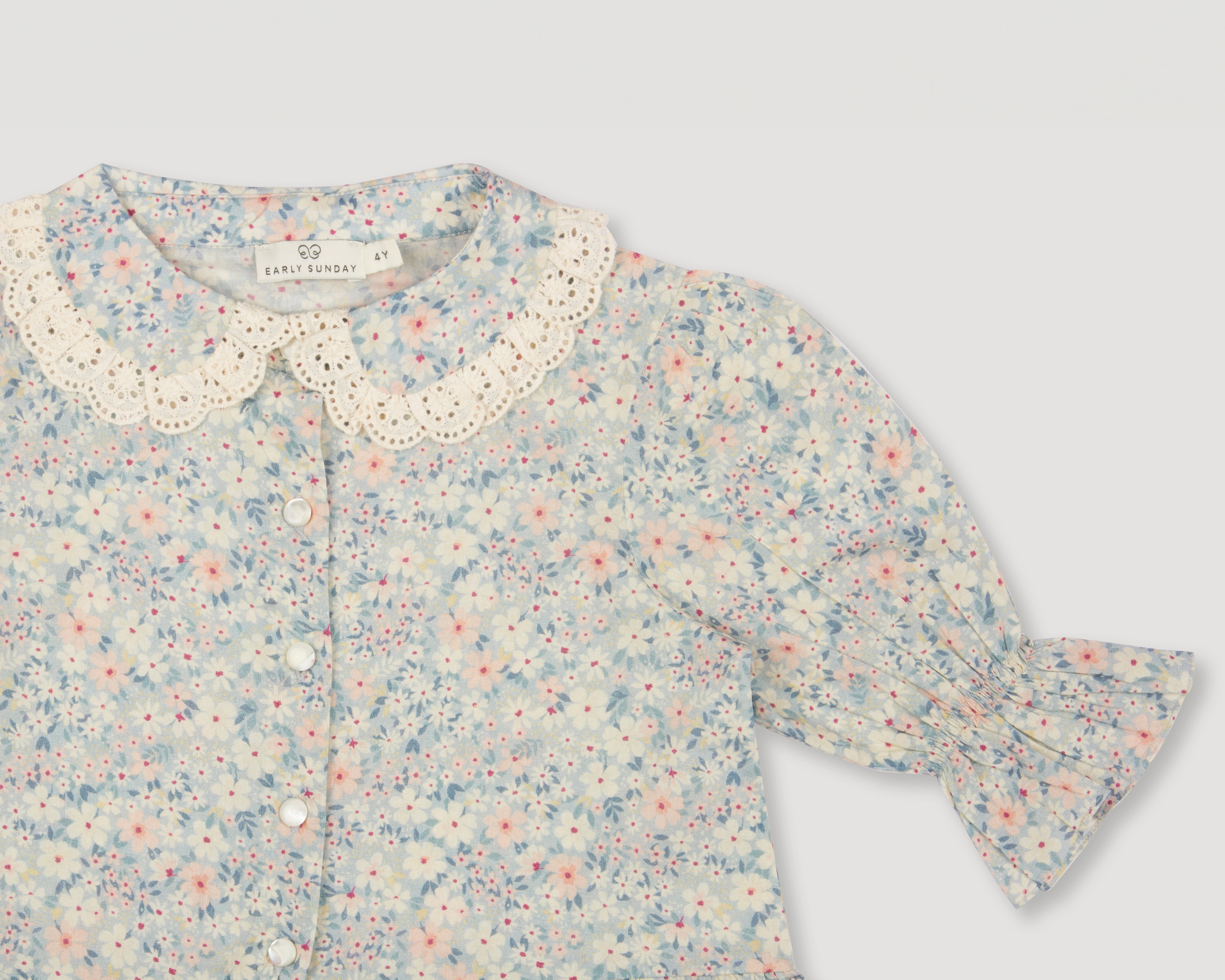 Early Sunday, Iris Blouse in Amelia print, made from Printed Cotton Cambric fabric, featuring relaxed fit with delicate detailing for a timeless and feminine look, shown in a closeup flat-lay view