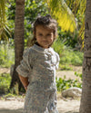 Early Sunday, Iris Blouse in Amelia print, made from Printed Cotton Cambric fabric, featuring relaxed fit with delicate detailing for a timeless and feminine look, shown in a close-up side view of a model wearing it