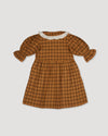 Early Sunday, Jacky Dress in Almond Checks, made from Cotton Yarn Dyed Brushed Checks fabric, featuring White contrast scallop-edge collar adds a sweet vintage touch, shown in a back flat-lay view