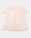 Early Sunday, Jane Dress in Butterfly Print color, made from printed cotton tiny swiss dobby fabric, featuring Smocked / embroidered yoke, peter pan collar and puffed short sleeves, shown in a back flat-lay view
