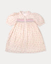 Early Sunday, Jane Dress in Butterfly Print color, made from printed cotton tiny swiss dobby fabric, featuring Smocked / embroidered yoke, peter pan collar and puffed short sleeves, shown in a front flat-lay view