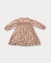 Early Sunday, Jeanette Dress in Bloom, made from Printed Viscose Twill fabric, featuring smocked chest with frilled neckline and soft gathered puff sleeves, shown in a back flat-lay view