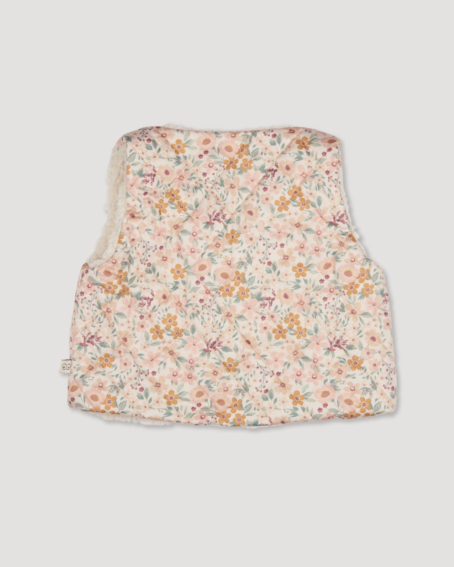 Early Sunday, Jilly Gilet in Floral print, made from Printed 60s Cotton Satin fabric, featuring a sleeveless gilet design with soft padding, shown in a back flat-lay view