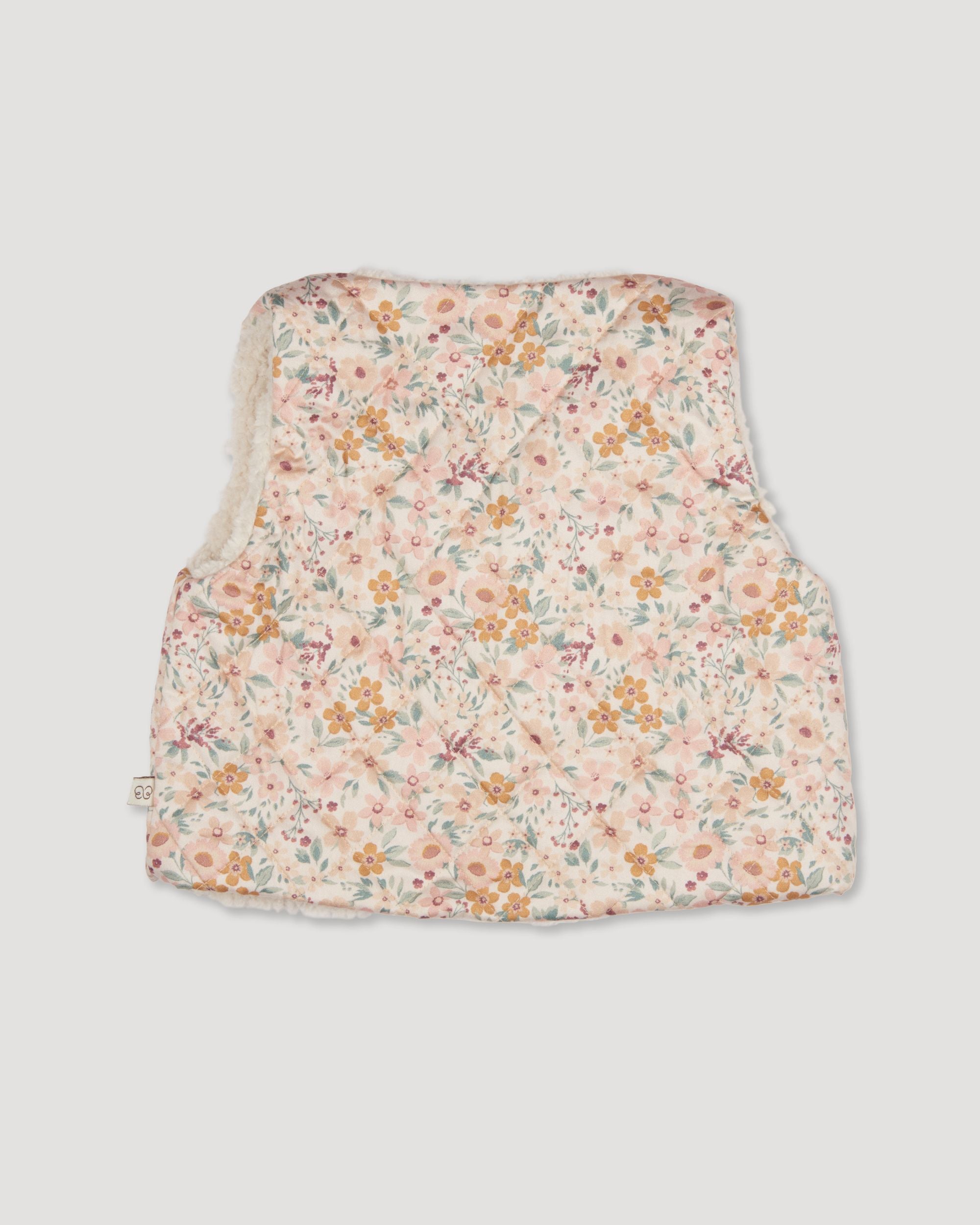 Early Sunday, Jilly Gilet in Floral print, made from Printed 60s Cotton Satin fabric, featuring a sleeveless gilet design with soft padding, shown in a back flat-lay view