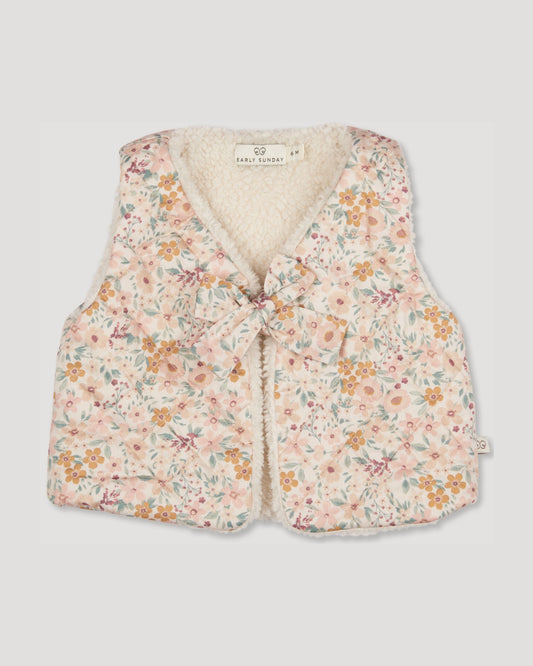 Early Sunday, Jilly Gilet in Floral print, made from Printed 60s Cotton Satin fabric, featuring a sleeveless gilet design with soft padding, shown in a front flat-lay view