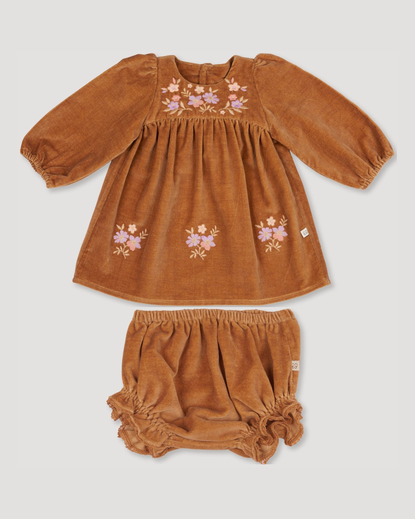Early Sunday, Joni Baby Dress & Bloomer Set in Almond color, made from Dyed Cotton Velvet fabric, featuring long puff sleeves & gathered waist with matching bloomers, shown in a front flat-lay view