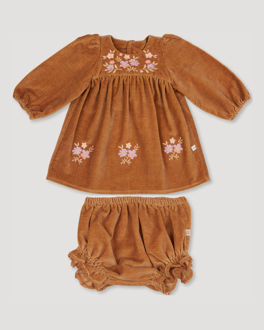 Early Sunday, Joni Baby Dress & Bloomer Set in Almond color, made from Dyed Cotton Velvet fabric, featuring long puff sleeves & gathered waist with matching bloomers, shown in a front flat-lay view