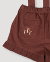 Early Sunday, Joseph Short Dungaree in Caramel, made from Cotton Corduroy fabric, featuring short dungaree with adjustable straps, shown in a close-up of print