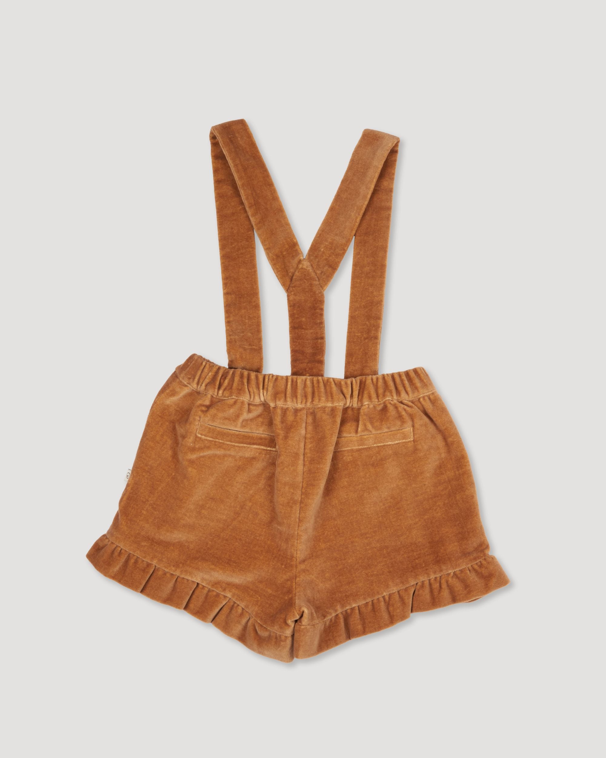 Early Sunday, Joseph Short Dungaree in Almond, made from Dyed Cotton Velvet fabric, featuring Softly structured short dungaree with classic detailing for a vintage-inspired look, shown in a back flat-lay view