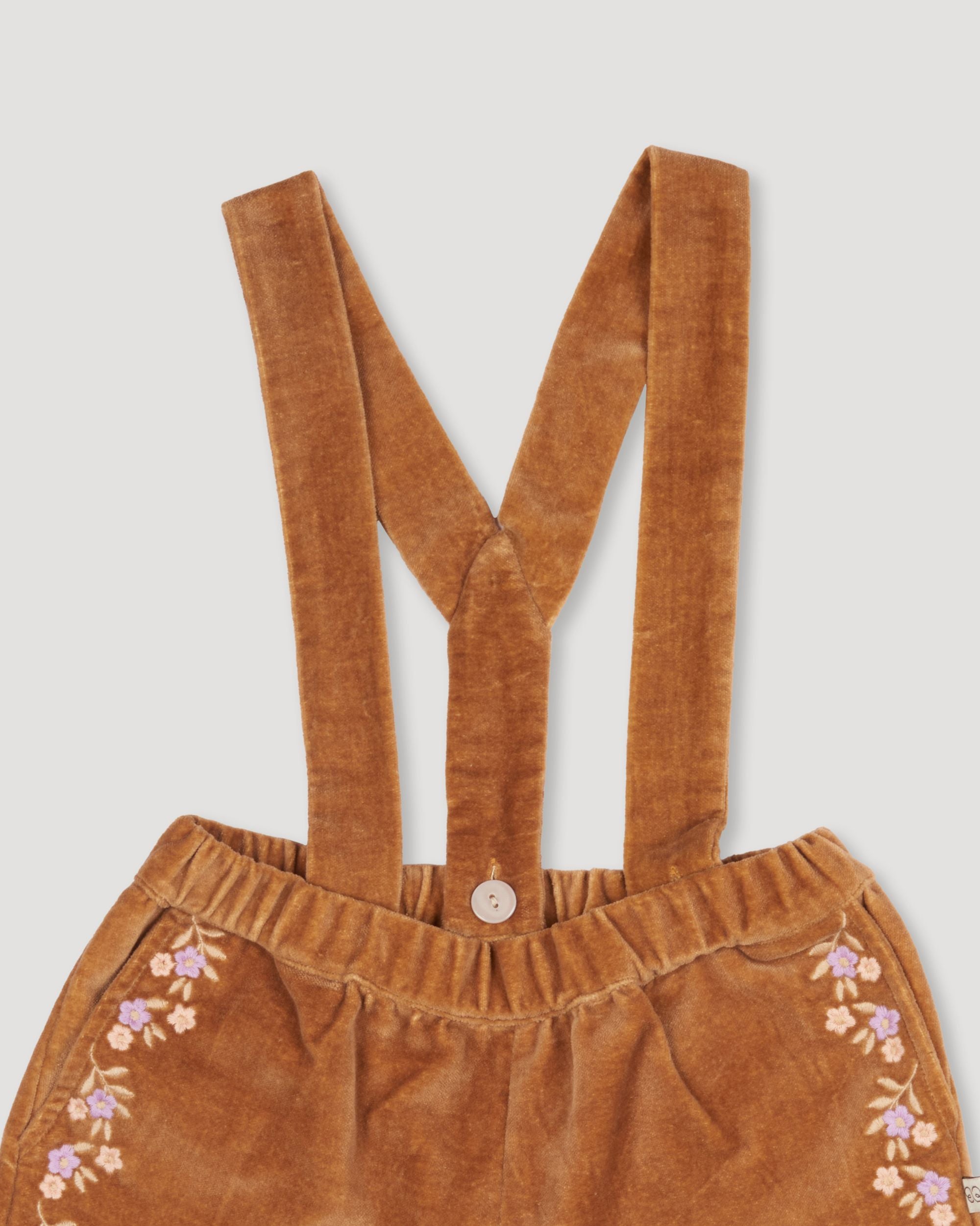 Early Sunday, Joseph Short Dungaree in Almond, made from Dyed Cotton Velvet fabric, featuring Softly structured short dungaree with classic detailing for a vintage-inspired look, shown in a closeup flat-lay view