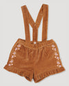 Early Sunday, Joseph Short Dungaree in Almond, made from Dyed Cotton Velvet fabric, featuring Softly structured short dungaree with classic detailing for a vintage-inspired look, shown in a front flat-lay view