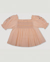 Early Sunday, Judith Blouse in Warm Sand color, made from Cotton Seersucker fabric, featuring relaxed fit with delicate finishes, combining style and functionality, shown in a back flat-lay view