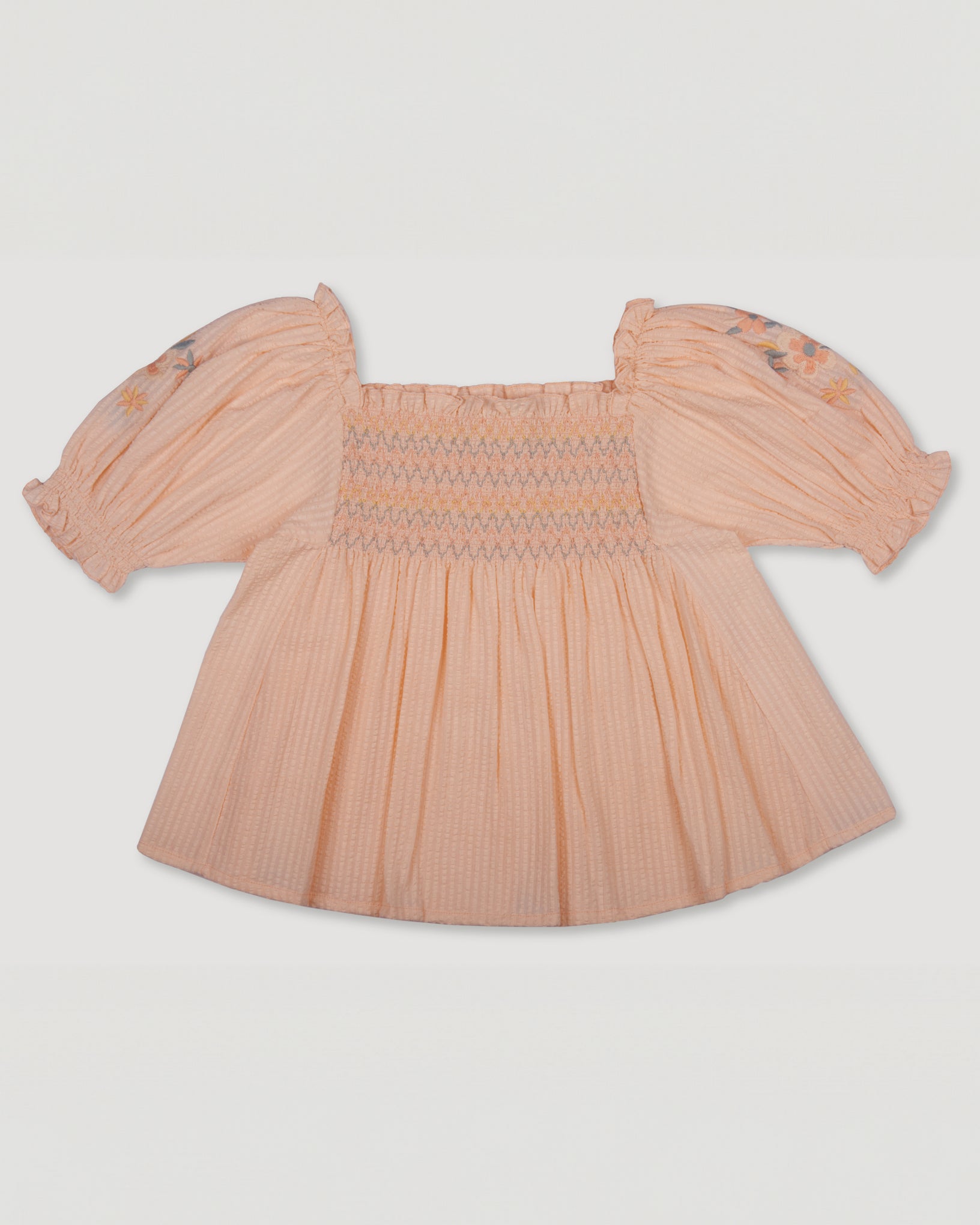 Early Sunday, Judith Blouse in Warm Sand color, made from Cotton Seersucker fabric, featuring relaxed fit with delicate finishes, combining style and functionality, shown in a back flat-lay view