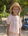 Early Sunday, Judith Blouse in Warm Sand color, made from Cotton Seersucker fabric, featuring relaxed fit with delicate finishes, combining style and functionality, shown in a front view of model wearing it