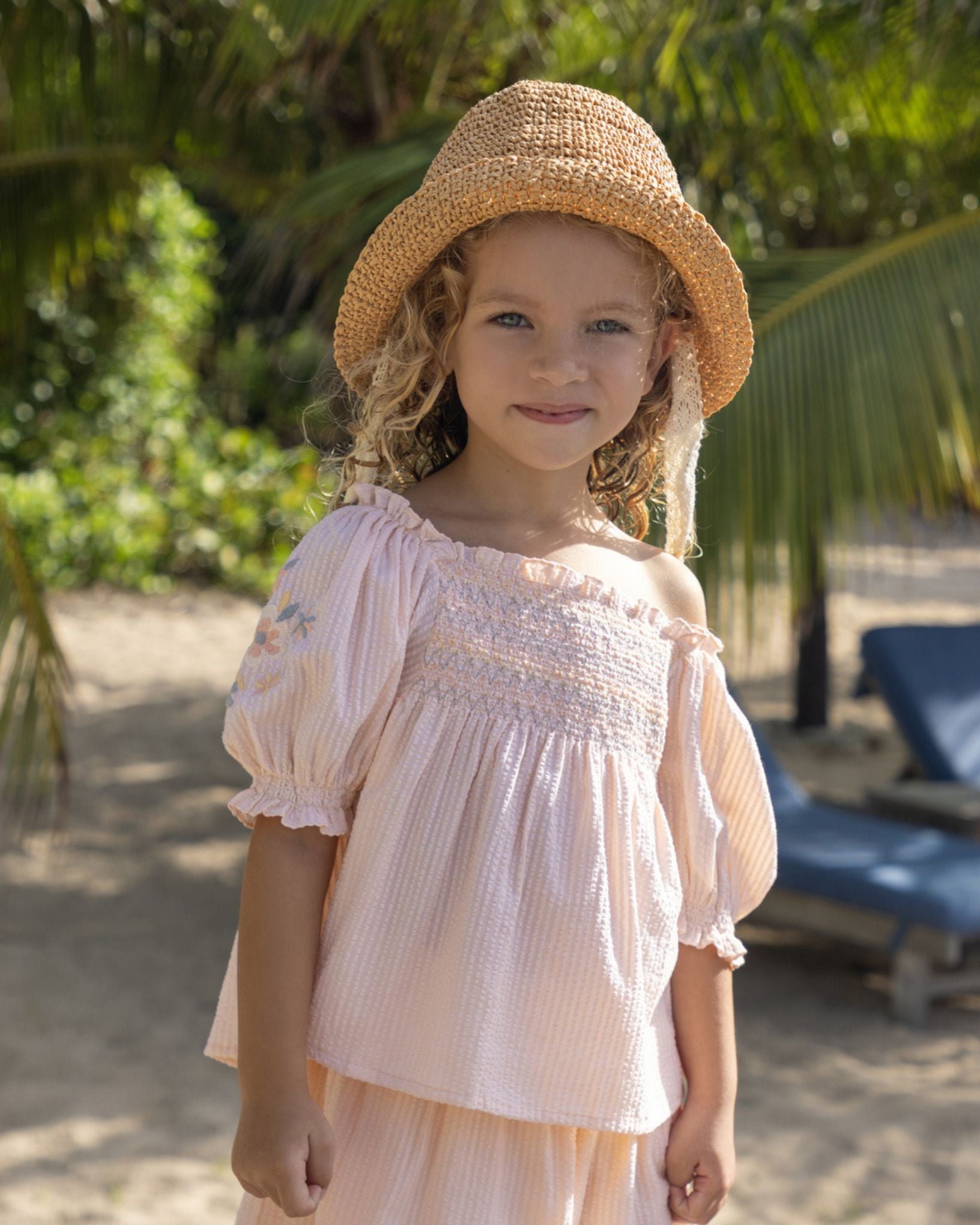 Early Sunday, Judith Blouse in Warm Sand color, made from Cotton Seersucker fabric, featuring relaxed fit with delicate finishes, combining style and functionality, shown in a front view of model wearing it