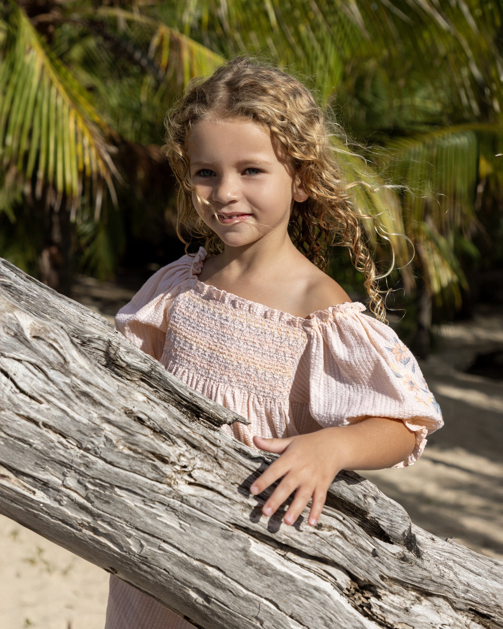 Early Sunday, Judith Blouse in Warm Sand color, made from Cotton Seersucker fabric, featuring relaxed fit with delicate finishes, combining style and functionality, shown in a close-up side view of a model wearing it