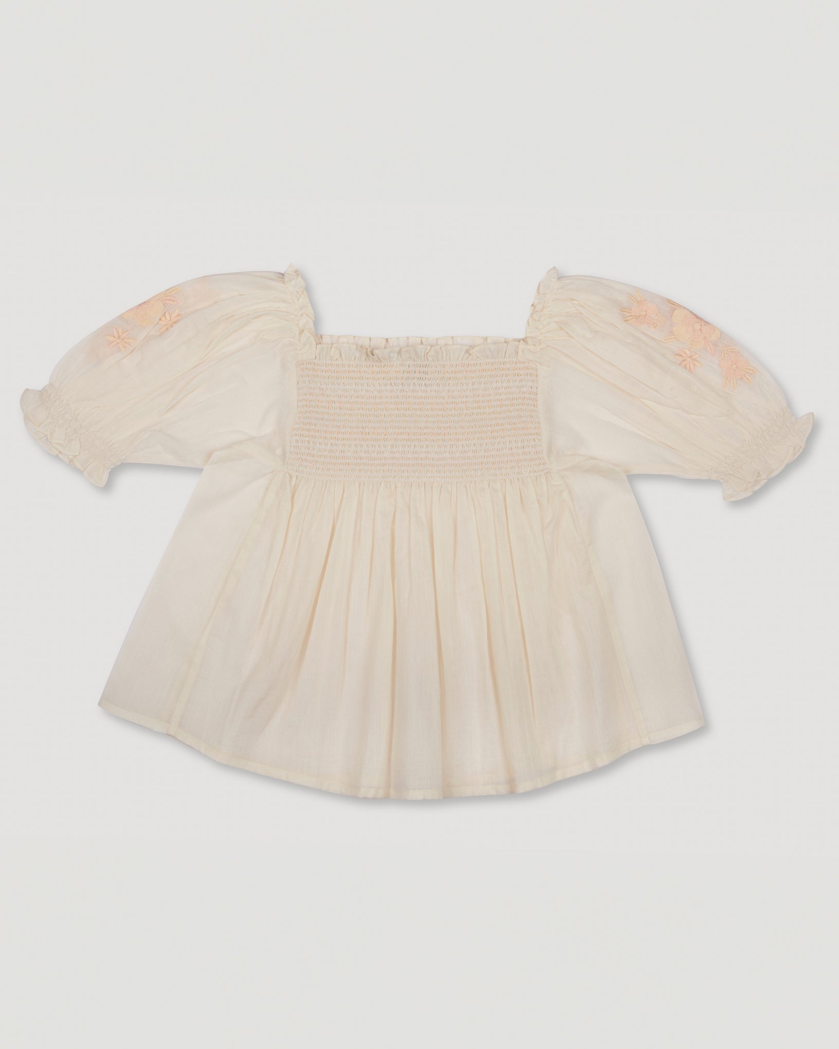 Early Sunday, Judith Blouse in Cream color, made from Cotton Voile fabric, featuring relaxed fit with delicate finishes, combining style and functionality, shown in a back flat-lay view