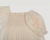 Early Sunday, Judith Blouse in Cream color, made from Cotton Voile fabric, featuring relaxed fit with delicate finishes, combining style and functionality, shown in a closeup flat-lay view