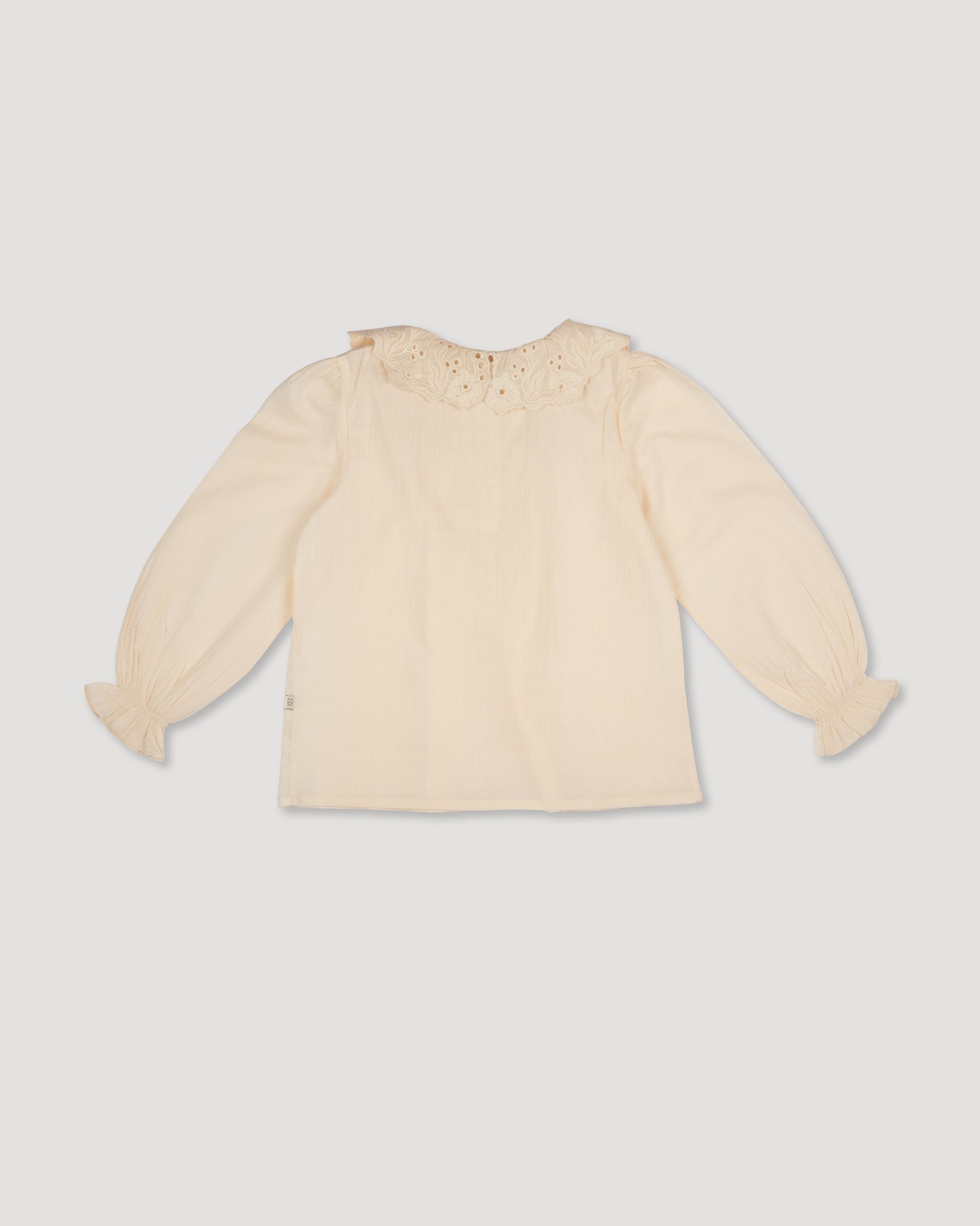 Early Sunday, Julianne Blouse in Hazelnut Cream, made from Dyed Cotton Swiss Dobby Tiny Dots fabric, featuring Comfort-first design with a playful silhouette, shown in a back flat-lay view