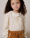 Early Sunday, Julianne Blouse in Hazelnut Cream, made from Dyed Cotton Swiss Dobby Tiny Dots fabric, featuring Comfort-first design with a playful silhouette, shown in a front view of model wearing it