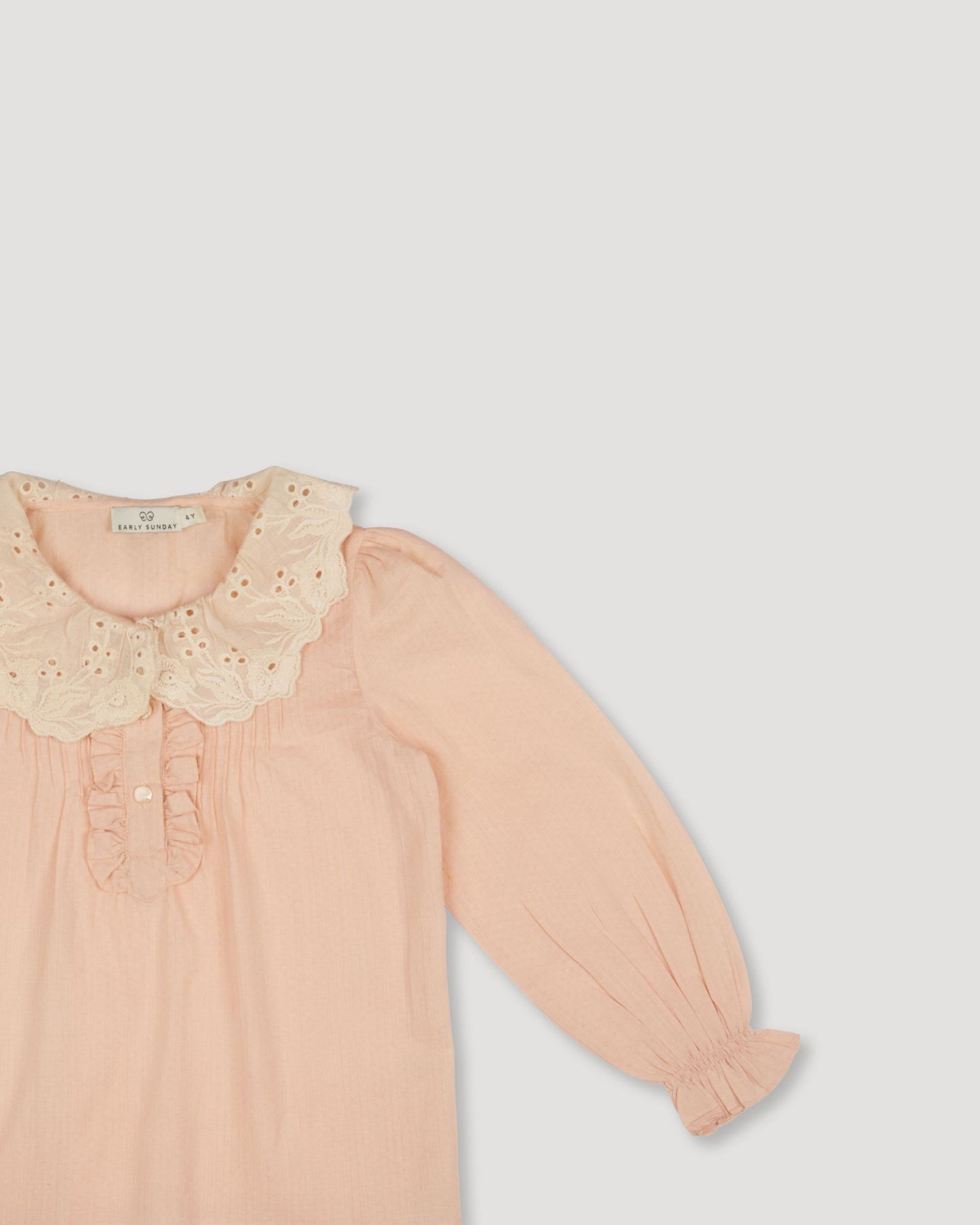 Early Sunday, Julianne Blouse in Nude, made from Dyed Cotton Swiss Dobby Tiny Dots fabric, featuring Comfort-first design with a playful silhouette, shown in a closeup flat-lay view