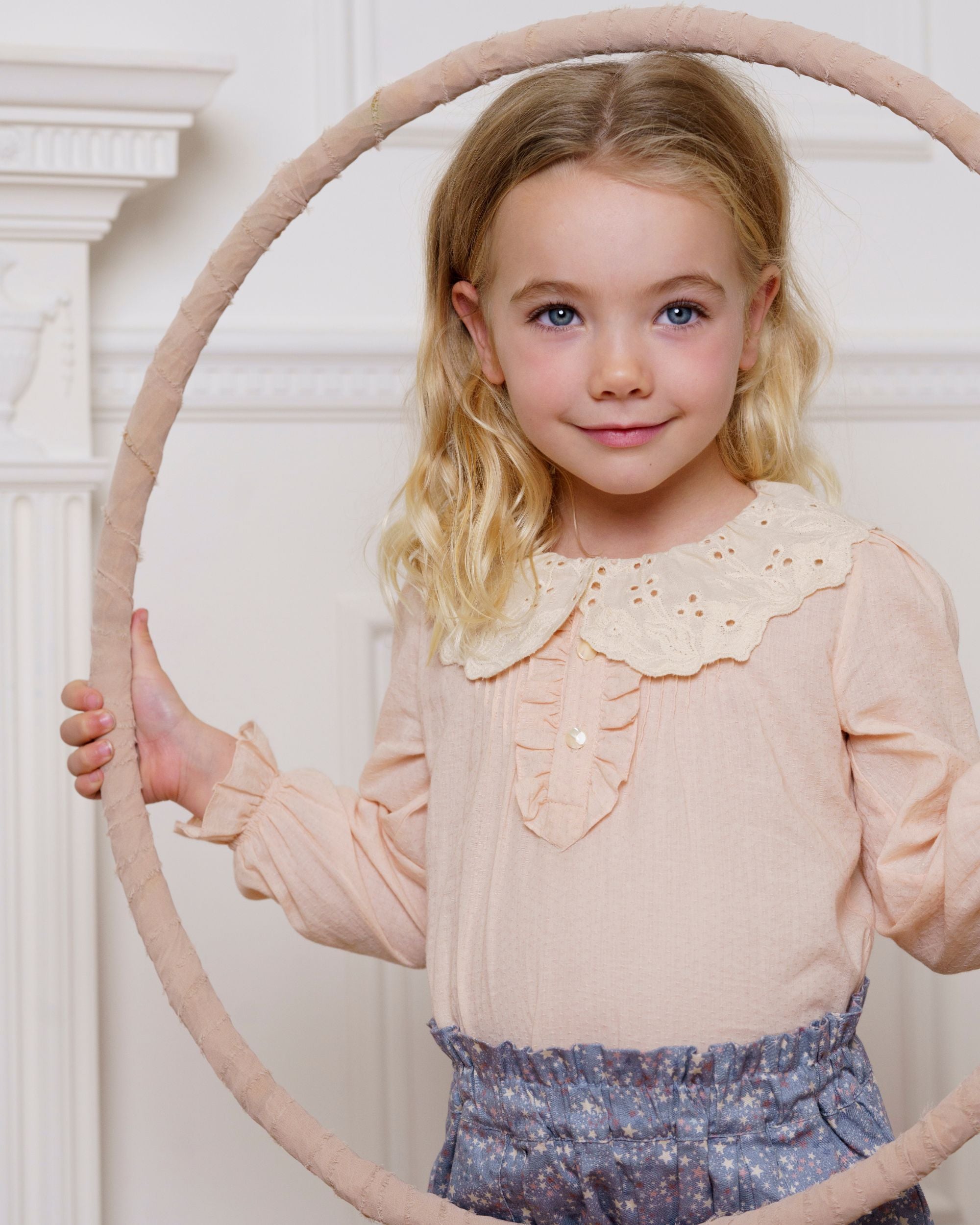 Early Sunday, Julianne Blouse in Nude, made from Dyed Cotton Swiss Dobby Tiny Dots fabric, featuring Comfort-first design with a playful silhouette, shown in a front view of model wearing it
