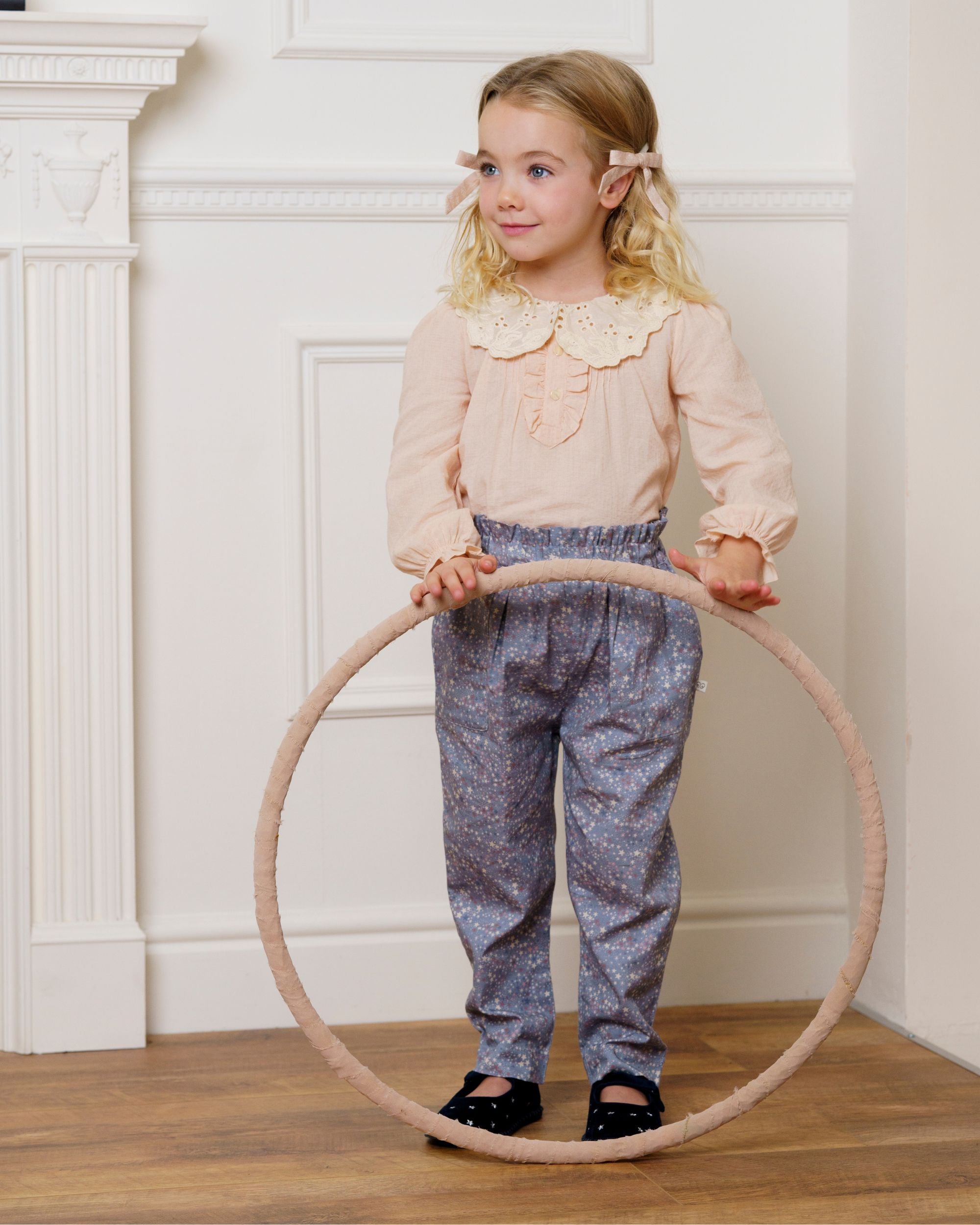 Early Sunday, Julianne Blouse in Nude, made from Dyed Cotton Swiss Dobby Tiny Dots fabric, featuring Comfort-first design with a playful silhouette, shown in a front view of a model wearing it in a studio setting
