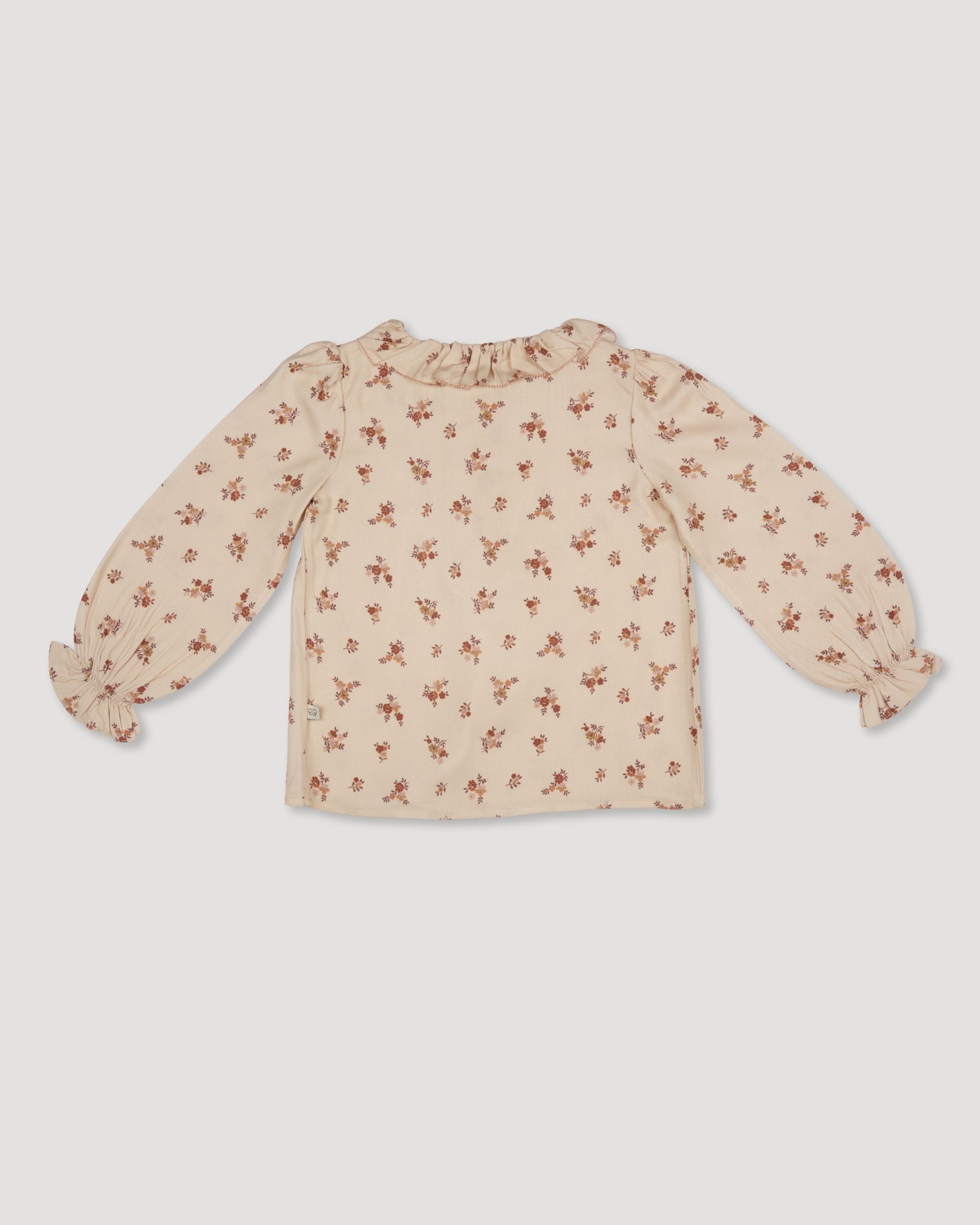 Early Sunday, Julianne Blouse in Ditsy Bouquet Cream print, made from Printed Viscose Rayon Twill fabric, featuring Comfort-first design with a playful silhouette, shown in a back flat-lay view