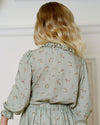 Early Sunday, Julianne Blouse in Ditsy Bouquet Jade print, made from Printed Viscose Rayon Twill fabric, featuring Comfort-first design with a playful silhouette, shown in a back view of model wearing it