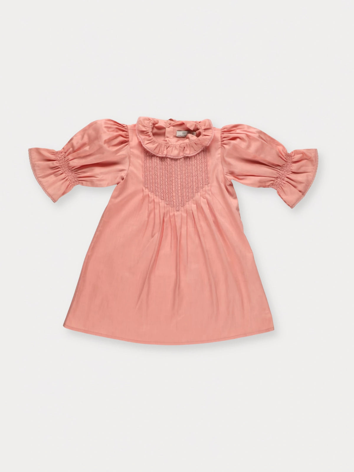 Early Sunday, Julie Dress in Blush Pink, made from Cotton Satin fabric, featuring cute floral embroidery on a Peter Pan collar with a smocked chest, shown in a front flat-lay view