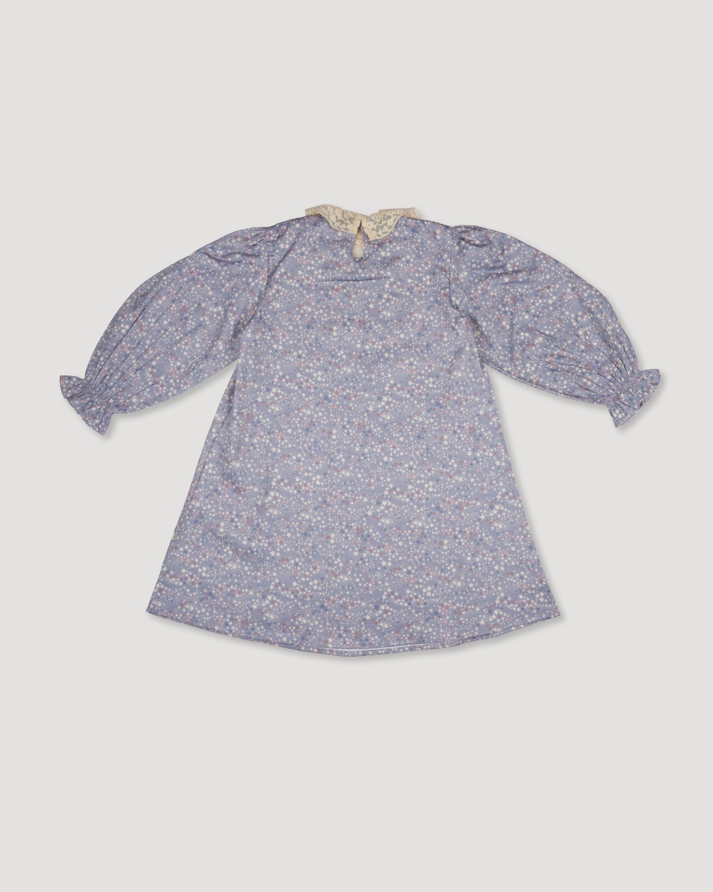Early Sunday, Julie Dress in Celestial print, made from Printed Cotton Satin fabric, featuring Delicate lace collar paired with a softly structured silhouette for a refined, timeless finish, shown in a back flat-lay view