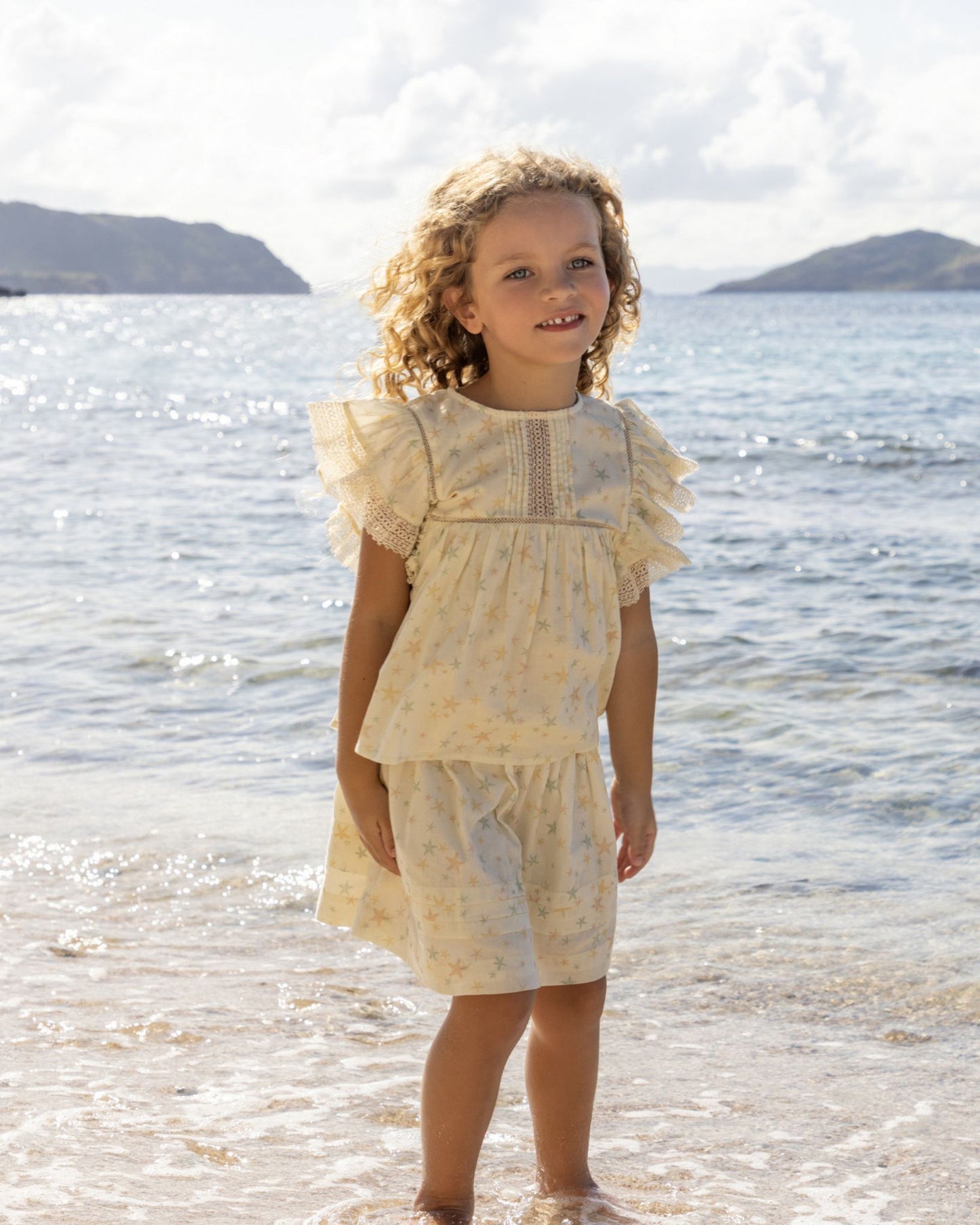 Early Sunday, Julie Long Skirt in Star Fish print, made from Printed Cotton Cambric fabric, featuring flowing long skirt with an easy fit, combining comfort with a flattering silhouette, shown in a front view of model wearing it