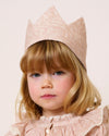 Early Sunday, Kids Crown in Feather print, made from Printed 60s Cotton Cambric fabric, featuring a design with pointed tips & an elasticated band, shown in a close-up shot of a model wearing it
