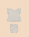 Early Sunday, Kitty Baby Blouse & Bloomer Set in Ivory color, made from 100% Cotton All Over Embroidery fabric, featuring a sleeveless flared sleeves with floral embroidery, shown in a back flat-lay view