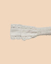 Early Sunday, Lace Headband in Ivory color, made from All-Over Embroidered fabric, featuring a soft lace headband with delicate swiss dot texture, shown in closeup flat-lay view
