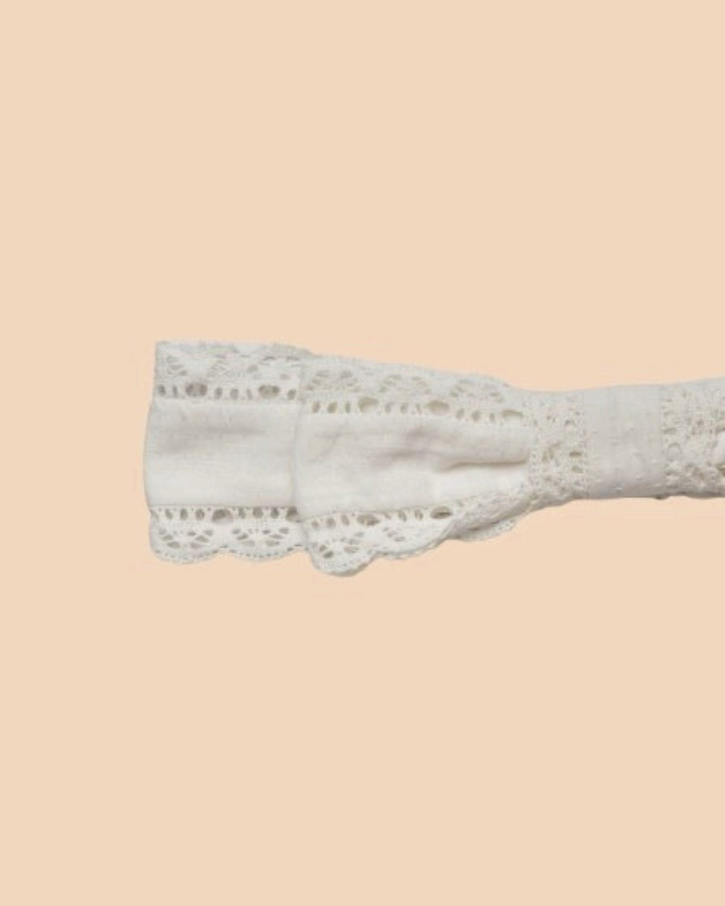 Early Sunday, Lace Headband in Ivory color, made from All-Over Embroidered fabric, featuring a soft lace headband with delicate swiss dot texture, shown in closeup flat-lay view