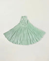 Early Sunday, Laura Dress in Mint color, made from 100% cotton double gauze solid fabric, featuring Crisscross ruffle straps with delicate trim accents and a softly gathered tiered skirt, shown in a back flat-lay view