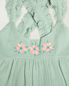 Early Sunday, Laura Dress in Mint color, made from 100% cotton double gauze solid fabric, featuring Crisscross ruffle straps with delicate trim accents and a softly gathered tiered skirt, shown in a closeup flat-lay view