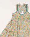 Early Sunday, Laura Dress in Emma Floral Mint color, made from printed 60s cotton cambric fabric, featuring Crisscross ruffle straps with delicate trim accents and a softly gathered tiered skirt, shown in a closeup flat-lay view