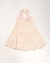 Early Sunday, Laura Dress in Butterfly Print color, made from printed cotton tiny swiss dobby fabric, featuring Crisscross ruffle straps with delicate trim accents and a softly gathered tiered skirt, shown in a back flat-lay view