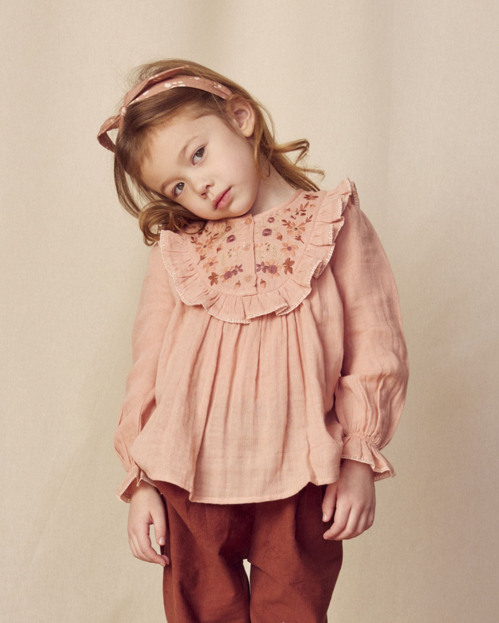 Early Sunday, Lauren Blouse in Dusty Pink, made from Cotton Double Gauze fabric, featuring relaxed fit with a floral embroidered yoke, shown in a close-up side view of a model wearing it