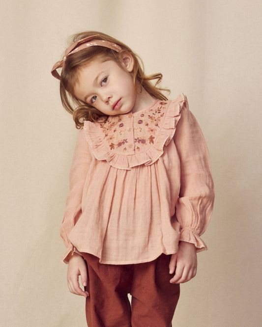 Early Sunday, Lauren Blouse in Dusty Pink, made from Cotton Double Gauze fabric, featuring relaxed fit with a floral embroidered yoke, shown in a close-up side view of a model wearing it