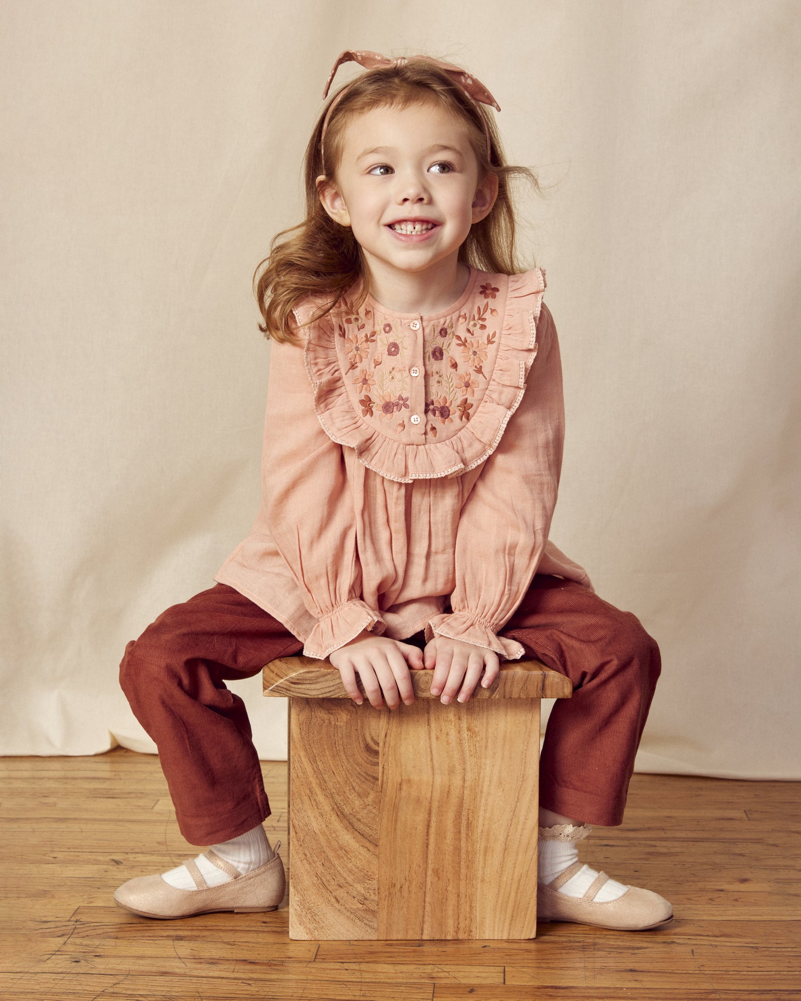 Early Sunday, Lauren Blouse in Dusty Pink, made from Cotton Double Gauze fabric, featuring relaxed fit with a floral embroidered yoke, shown in a front view of a model wearing it in a studio setting